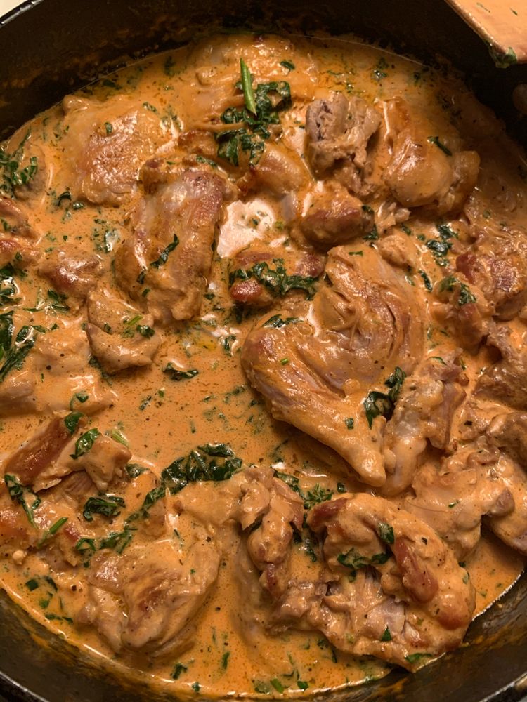 SKILLET CHICKEN THIGHS WITH CREAMY TOMATO BASIL SPINACH SAUCE
