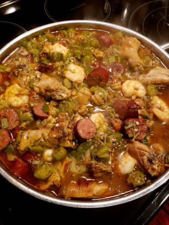okra stew with chicken, sausage, shrimp and crawfish tails, onion and green peppers￼￼