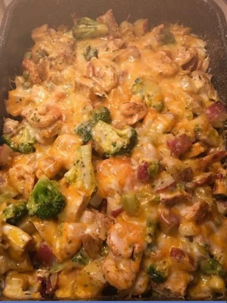 Chicken and Shrimp with Broccoli and Cheese served in a bowl