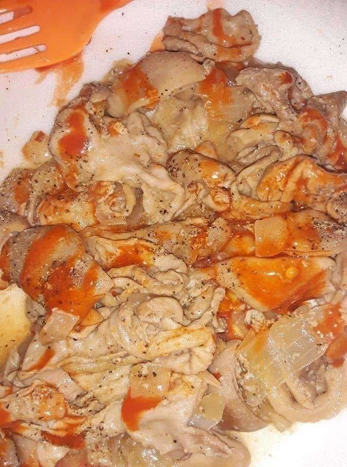 Delicious chitterlings recipe prepared with spices and served with sides.
