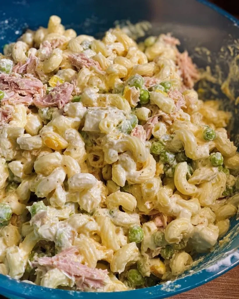 A bowl of Grandma's Tuna Macaroni Salad with colorful veggies and pasta