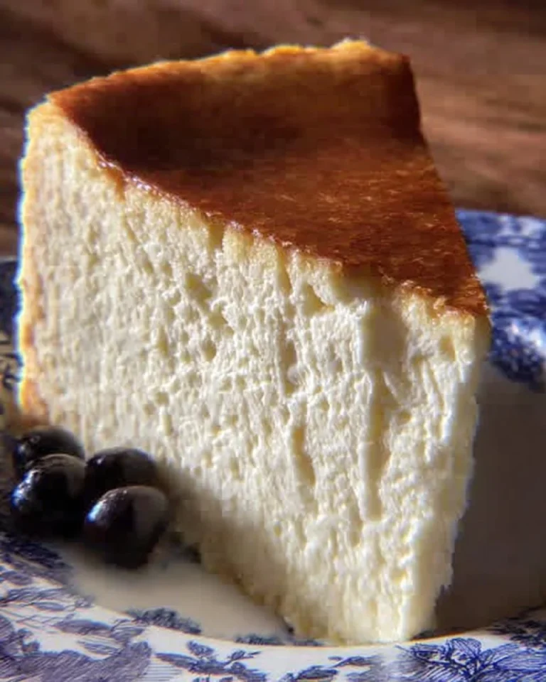Slice of delicious New York Cheesecake topped with fresh berries