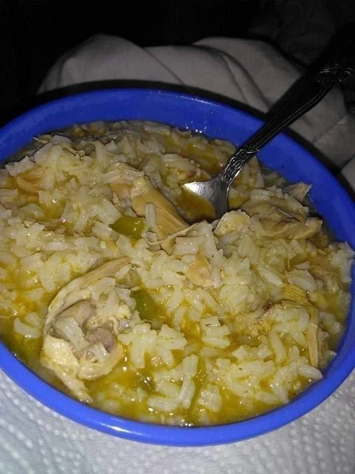 Delicious soulful chicken rice casserole dish garnished with herbs