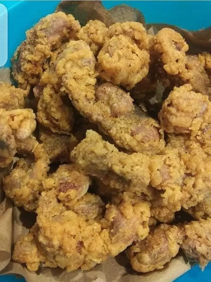 Crispy Southern fried chicken gizzards served on a plate with dipping sauce.